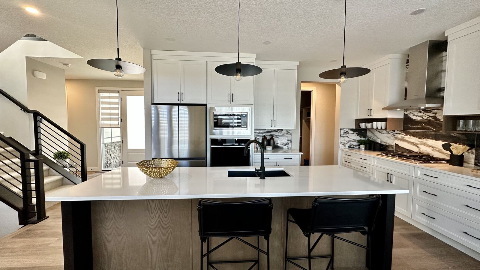 Finished kitchen in an Alliston home in Cimarron, Okotoks, painting and finishing by Enteco