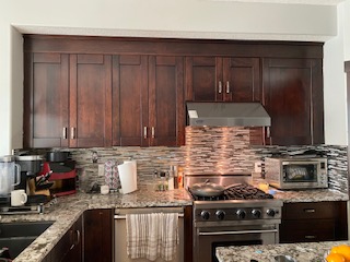 Dark espresso kitchen cabinets before painting, NE Calgary