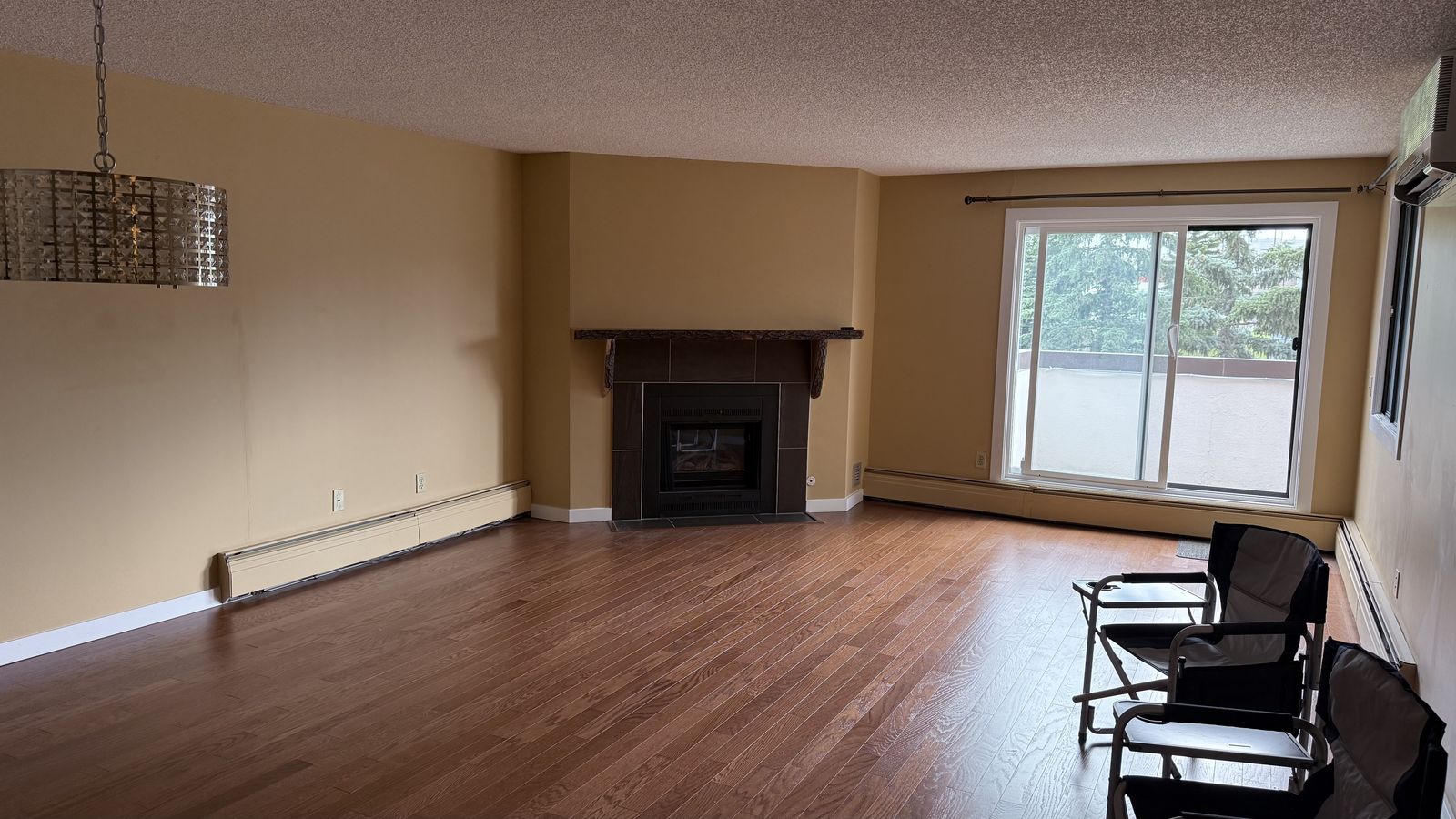 The same Calgary condo living room before renovation