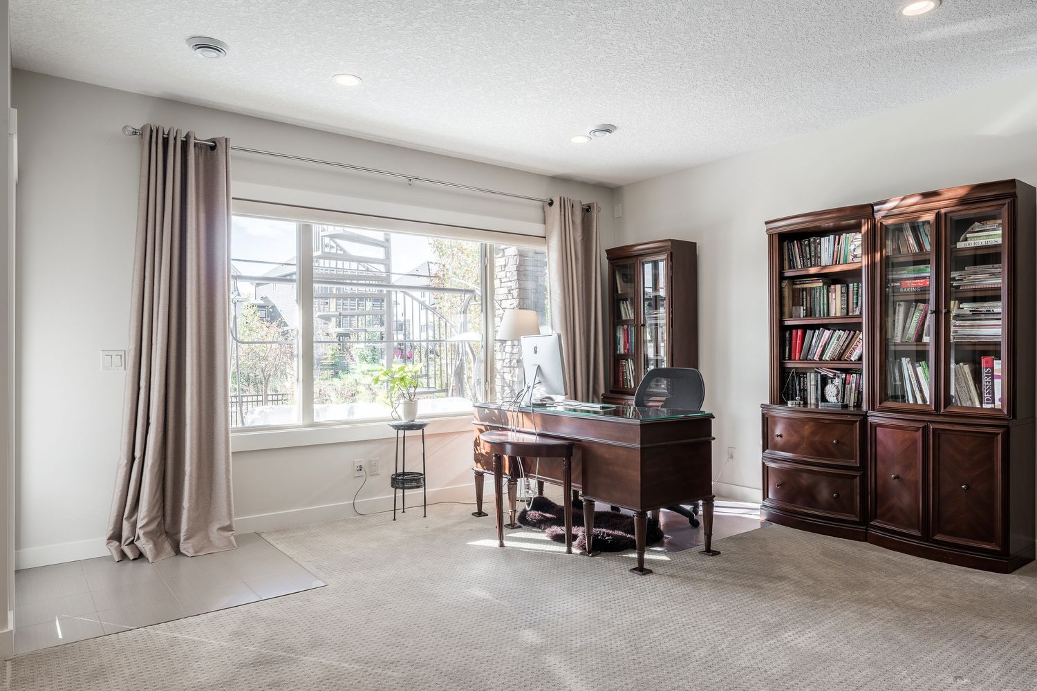 Finished basement home office with built-in bookcases, Cranbrook