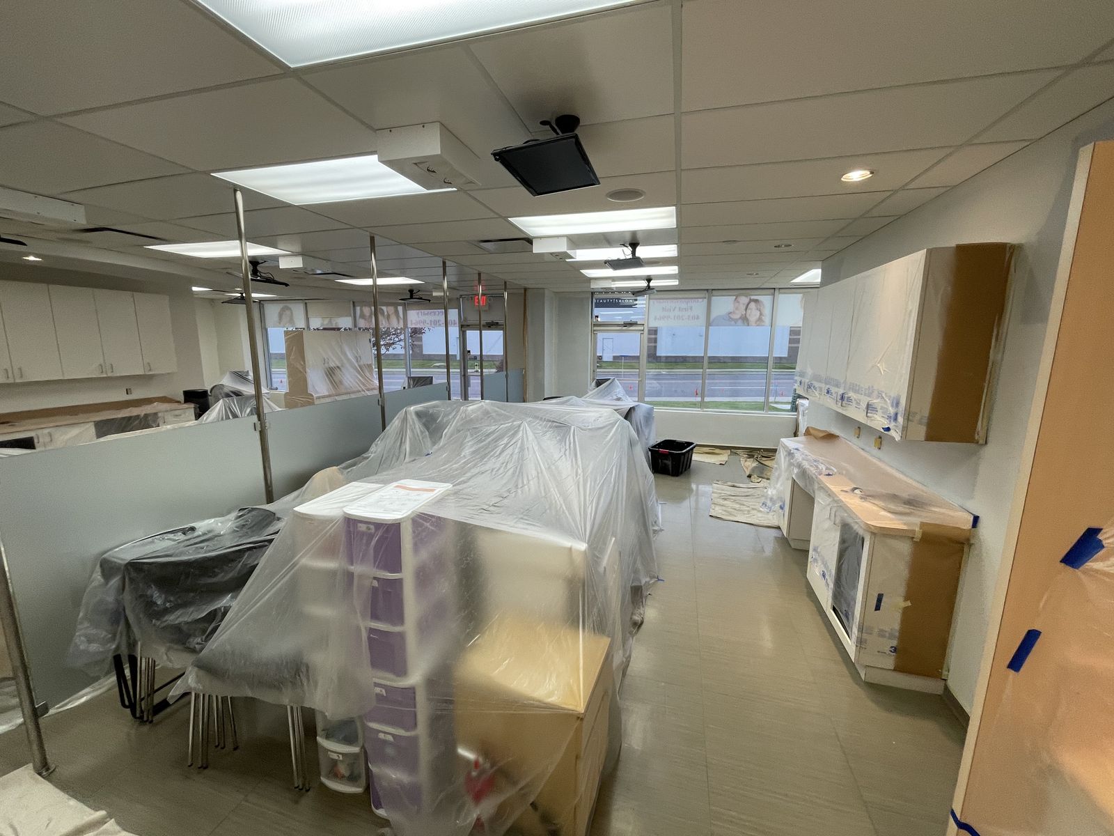 Office prepped with plastic sheeting before commercial painting