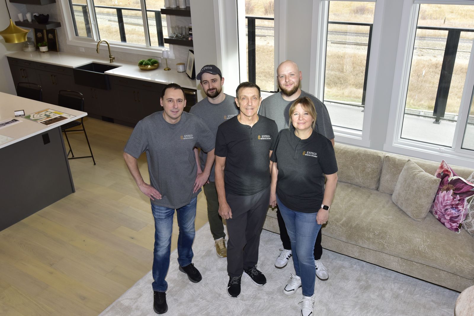 The Enteco crew in a finished Calgary home, seen from the upper floor