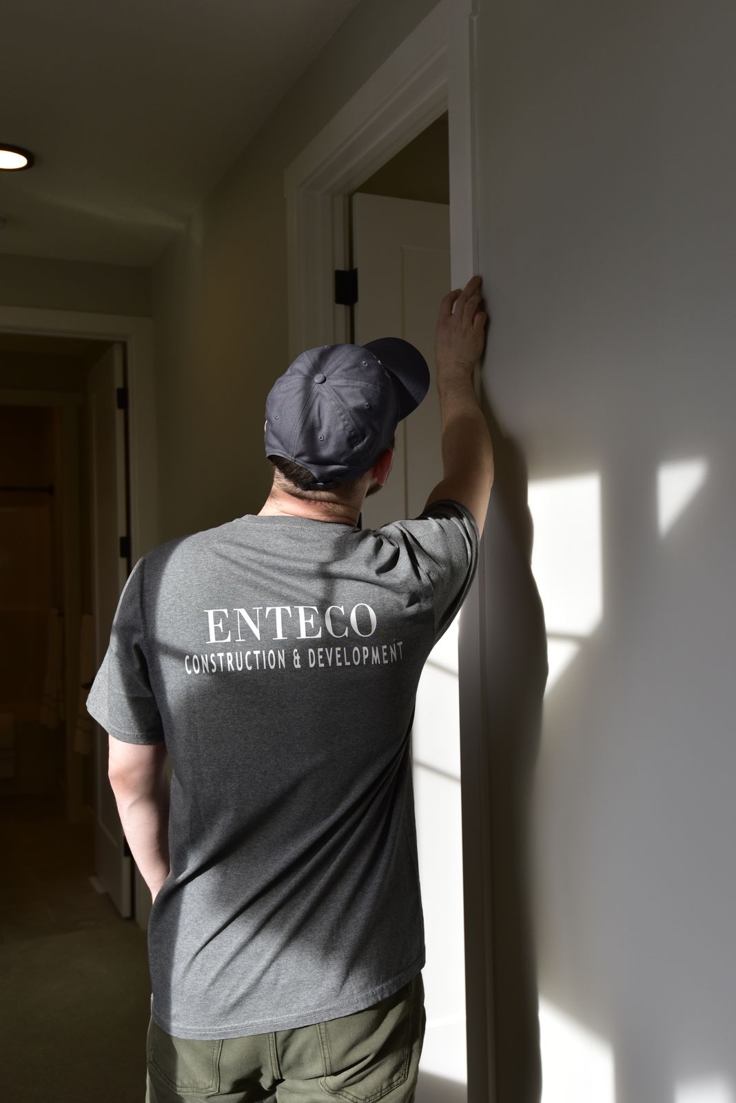 Enteco finisher checking a door frame on site
