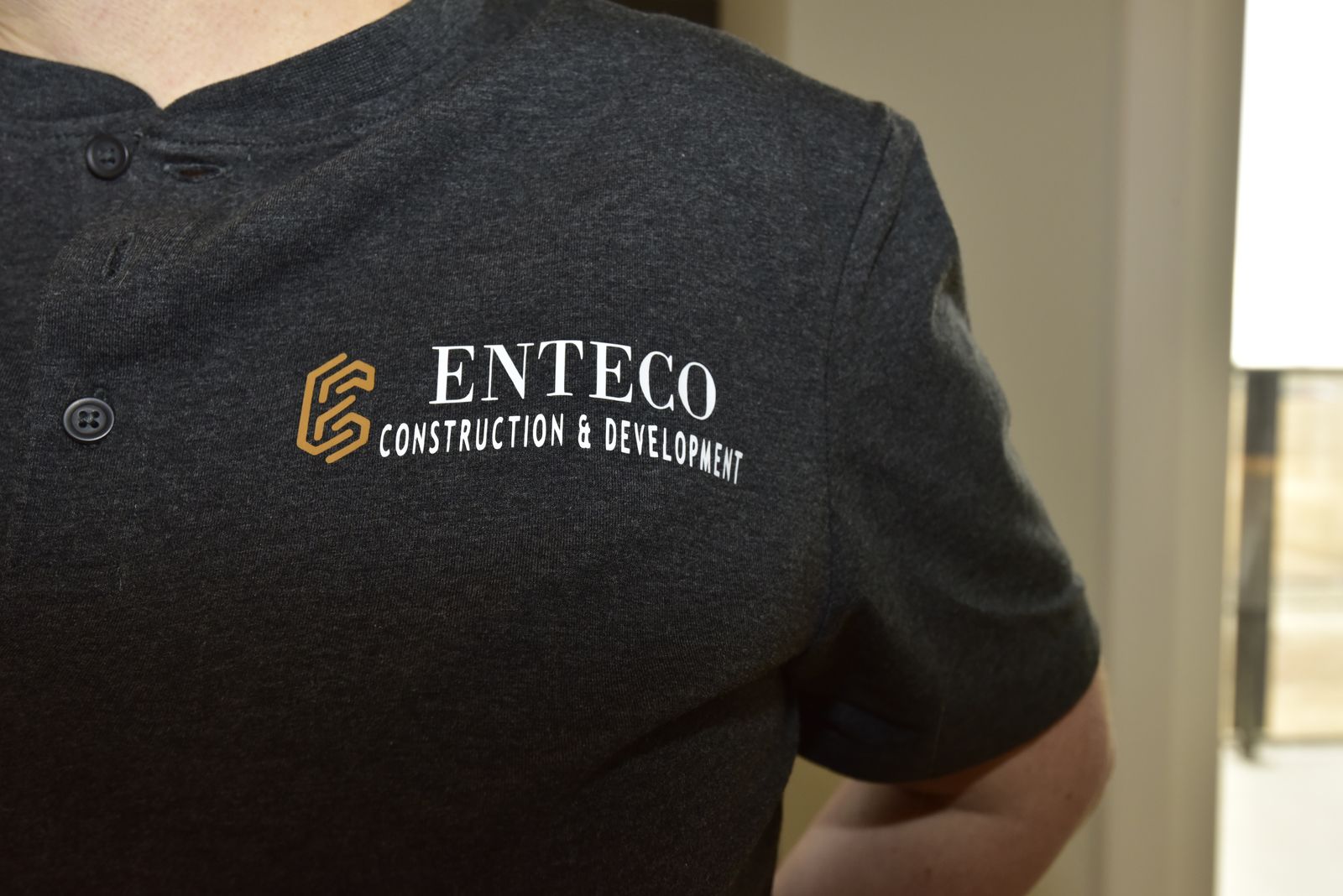The Enteco logo on a crew shirt