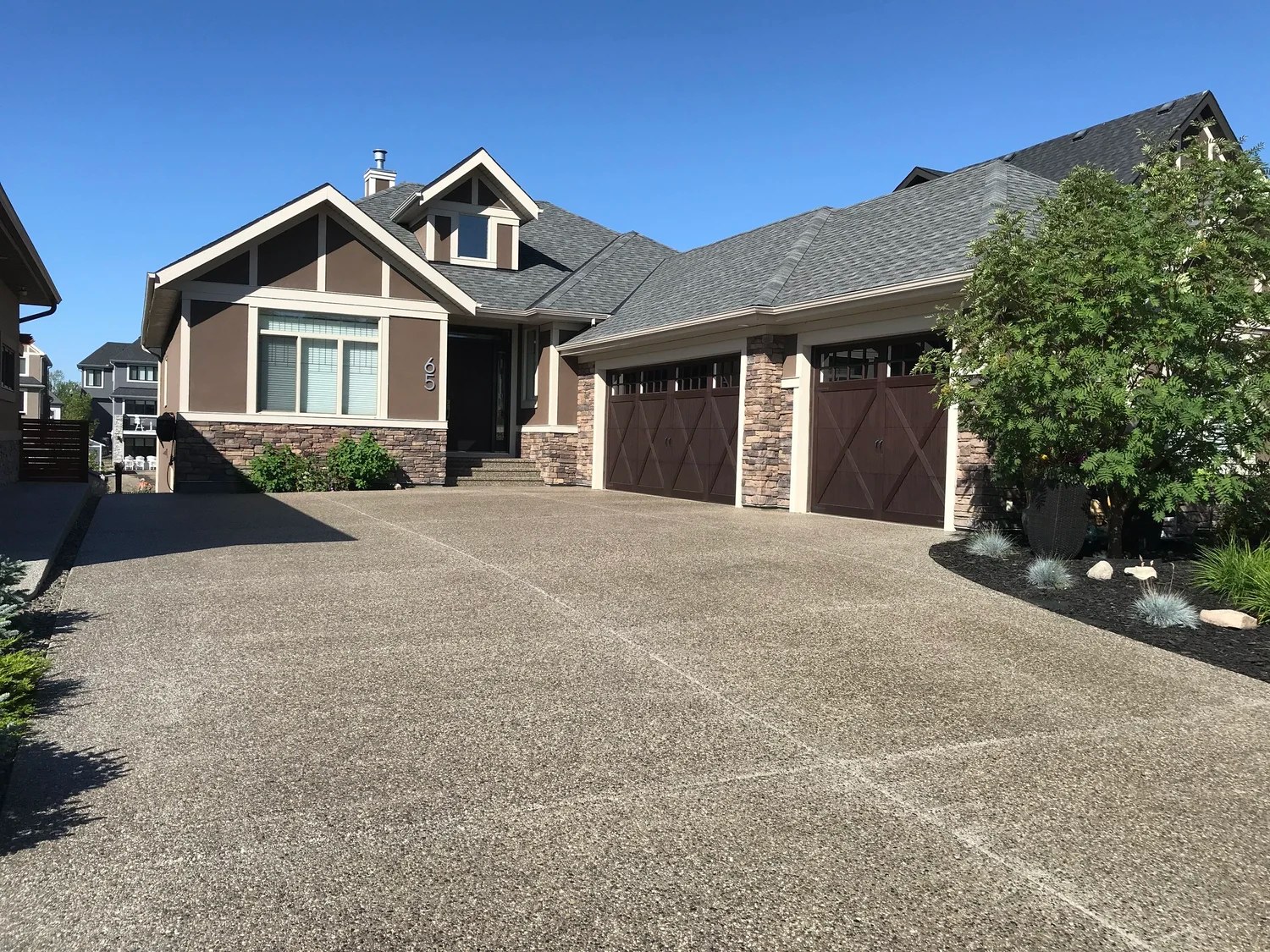 Calgary home exterior with finished garage doors