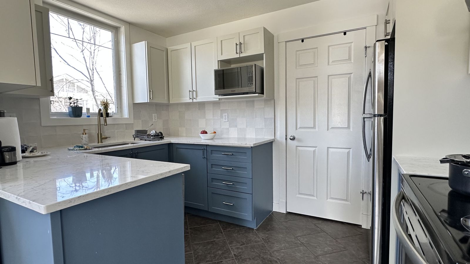 Same kitchen with blue and white painted cabinets, Wentworth